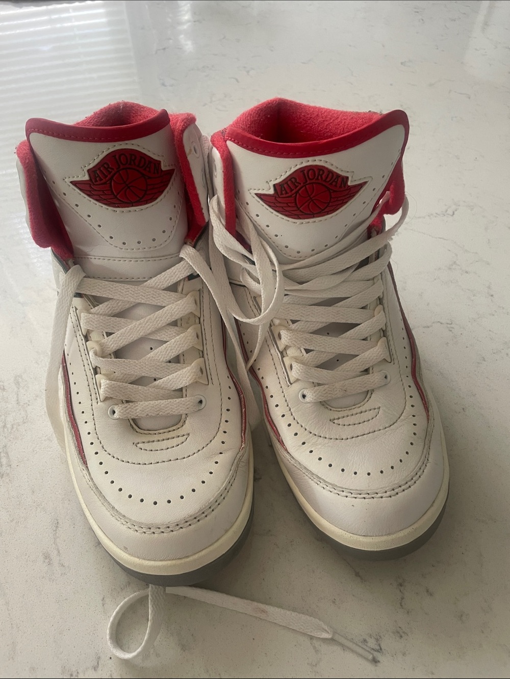 Jordan Women’s White and Red High-Top Sneakers